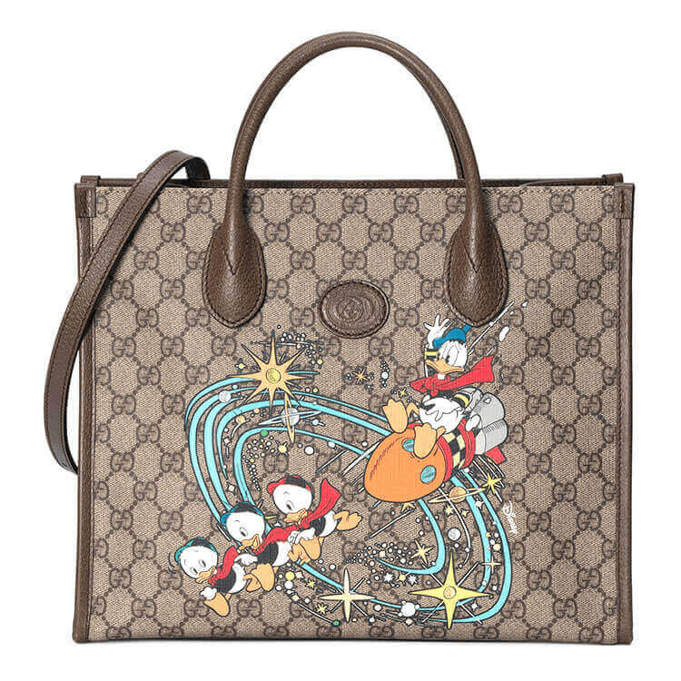 b2c3c86767b56334c1194a75a16acfe.png GUCCI Disney x Gucci Donald Duck Tote Bag - Image 1